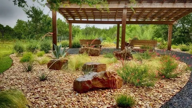 A xeriscaped Texas garden with a pergola